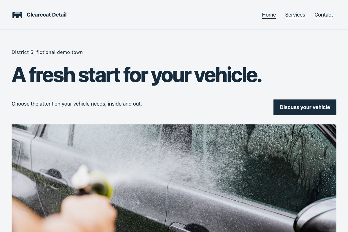 The home page of Clearcoat Detail, a fictional car detailing website, on a computer screen.